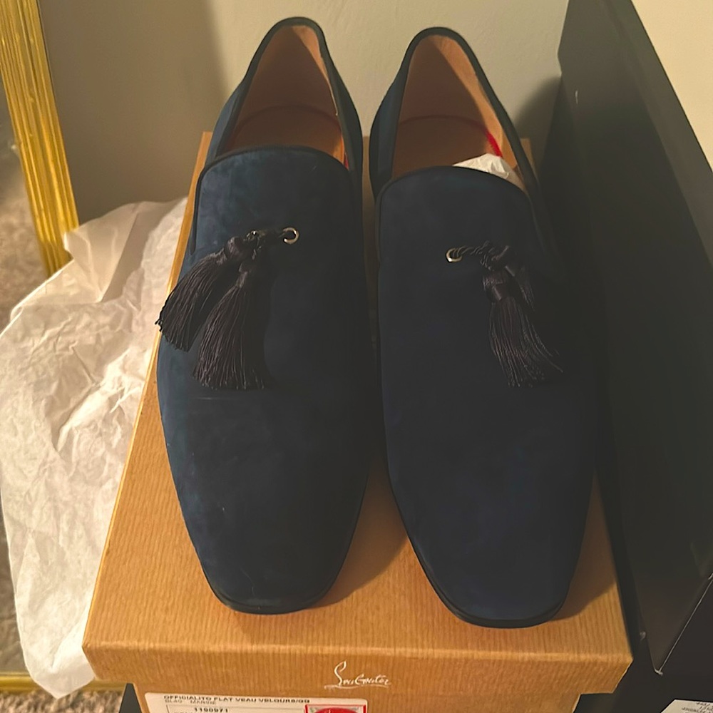 Christian Louboutins for a very reasonable price. Shoe is very simple & classy.